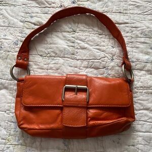 Little orange Wilson’s leather shoulder purse